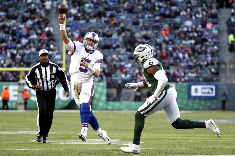 EAST RUTHERFORD, NEW JERSEY - NOVEMBER 11: Matt Barkley #5 of the Buffalo Bills attempts a pass against Brandon Copeland #51 of the New York Jets during the third quarter at MetLife Stadium on November 11, 2018 in East Rutherford, New Jersey. (Photo by Michael Owens/Getty Images)